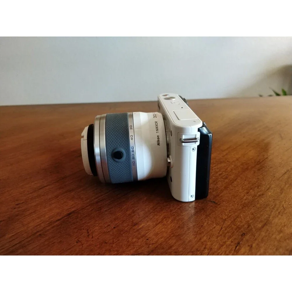 READ* Nikon 1 J1 White Digital Camera with 1 NIKKOR 10-30mm VR Lens